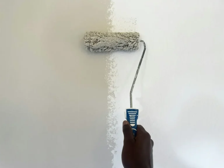 Painting a wall with a paint roller
