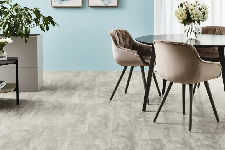 Dining area with upholstered chairs and light flooring